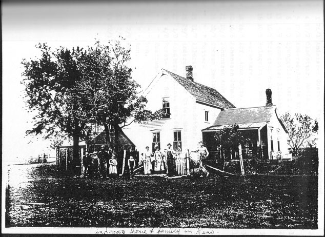 Andrew's family and their home in Kansas